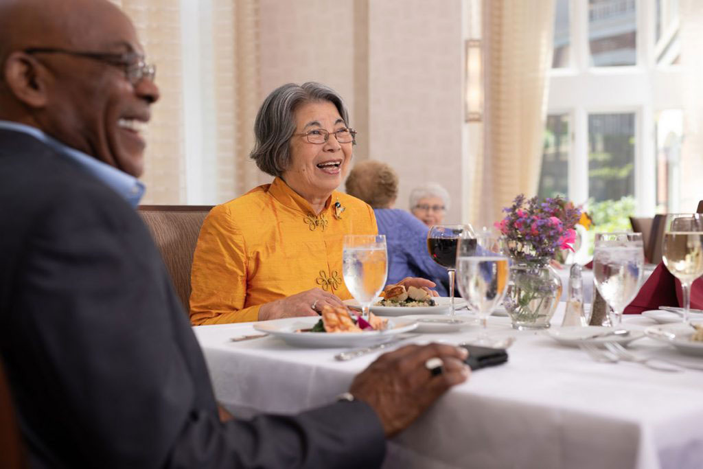 People dining together and laughing
