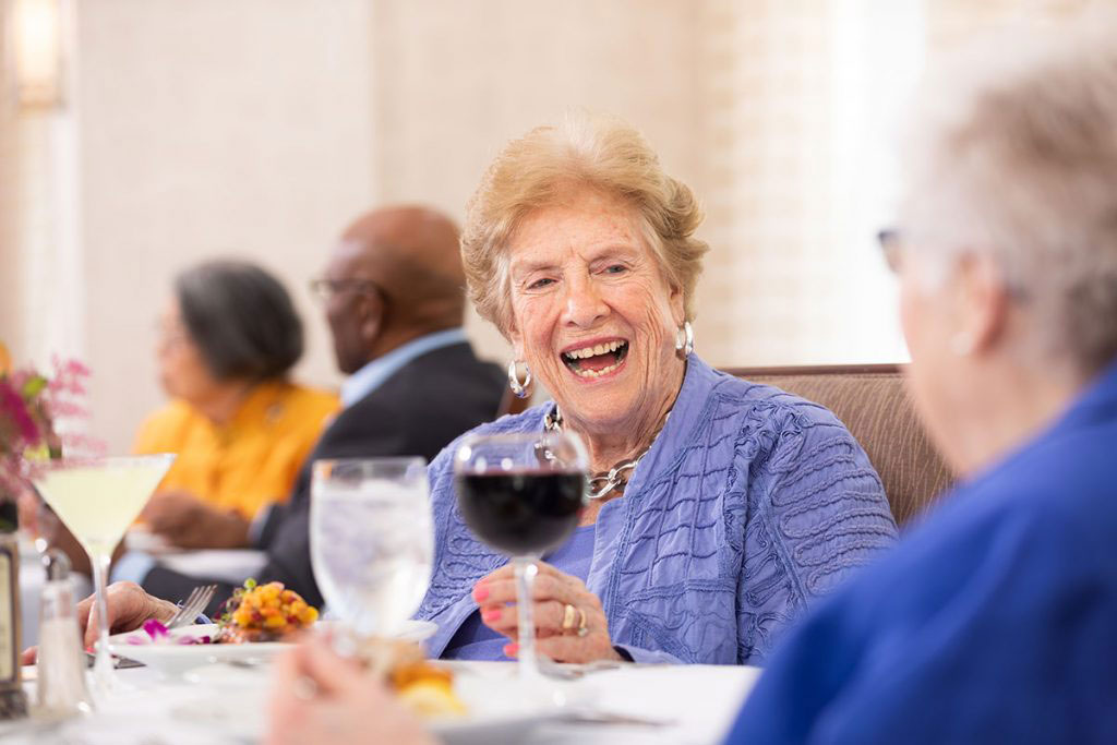 People dining together and laughing
