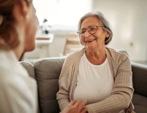 two women talking and smiling