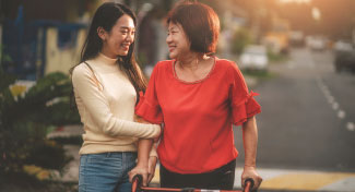 A mother and daughter walking