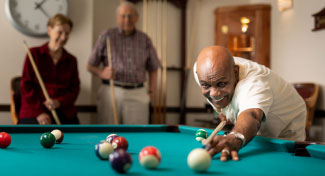 People playing billiards.