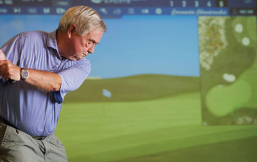 Man using a golf simulator