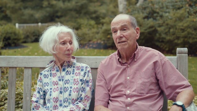 A couple sitting outdoors