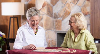 Two women playing game of Scrabble