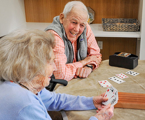 A couple playing a card game